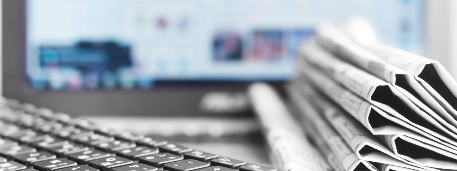 Newspapers and Laptop. Different Concepts for News –  Network or Traditional Tabloid Journals. Data Sources – Electronic Screen of Computer or Paper Pages of Magazines, Internet or Papers
