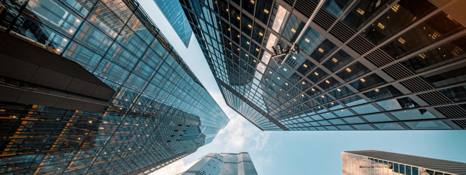 Looking directly up at the skyline of the financial district in central City of London, UK – creative stock image