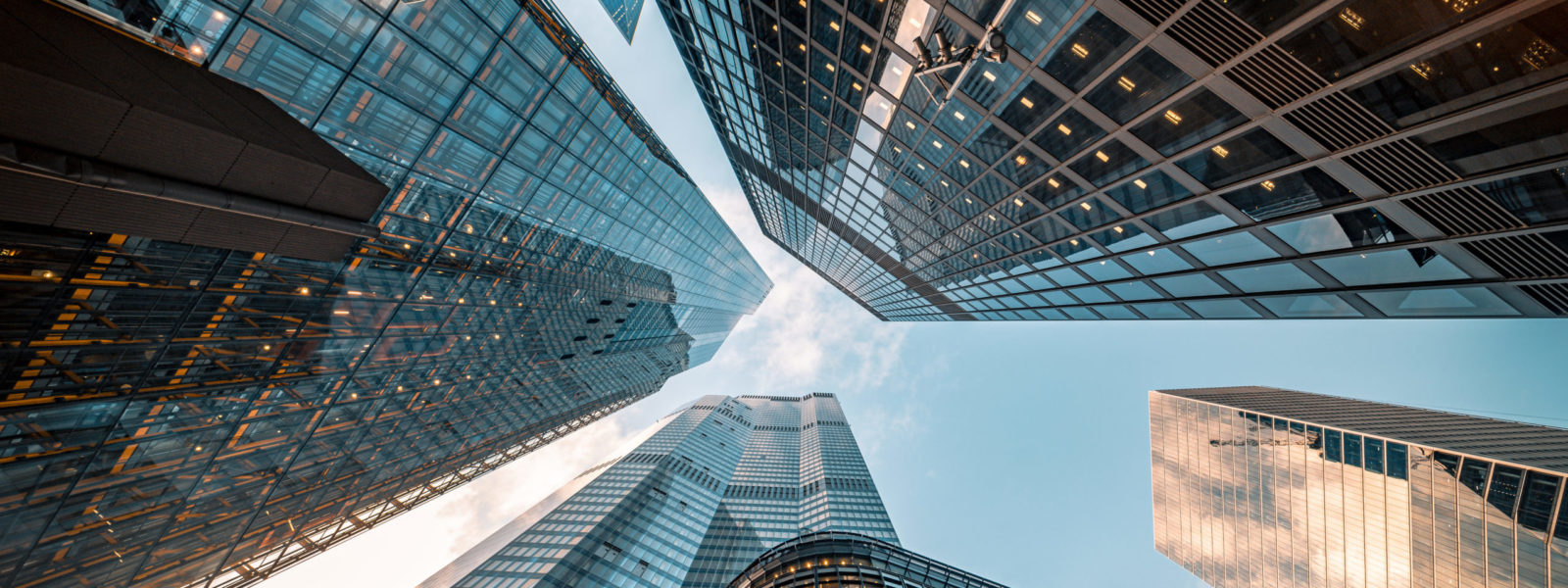 Looking directly up at the skyline of the financial district in central City of London, UK – creative stock image