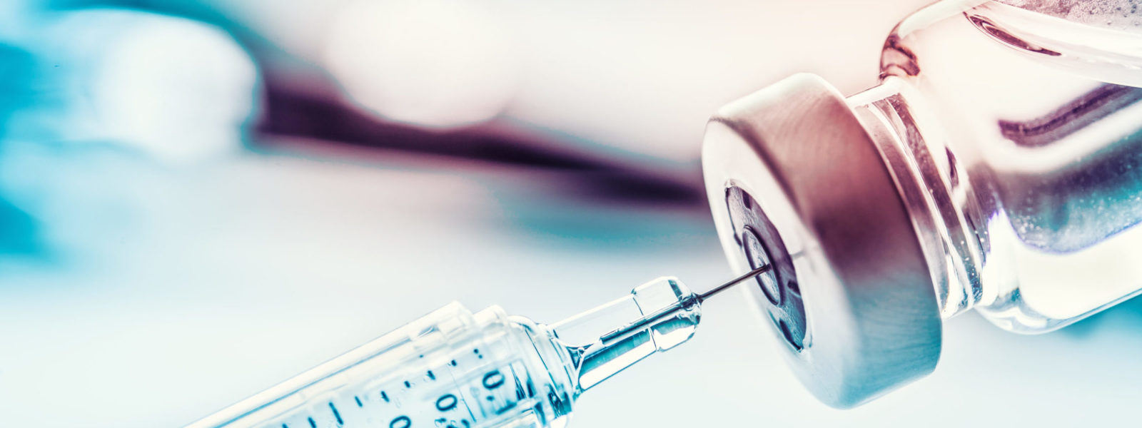 Close-up medical syringe with a vaccine.