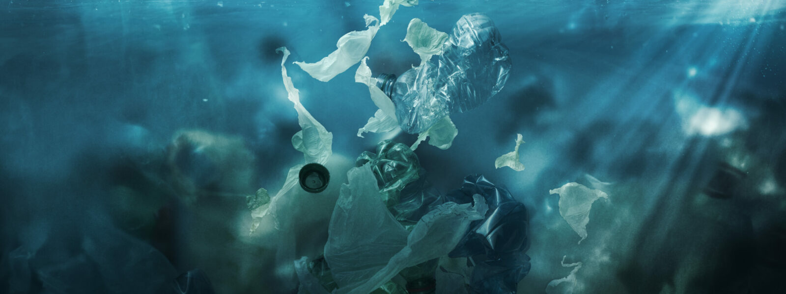 Toxic plastic waste floating underwater in the ocean