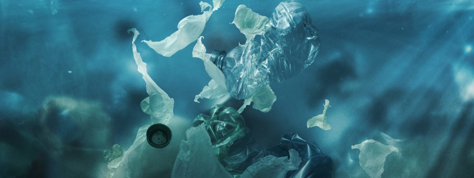 Toxic plastic waste floating underwater in the ocean