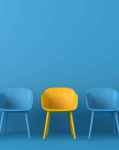 Yellow chair standing out from the crowd. Business concept. 3D rendering