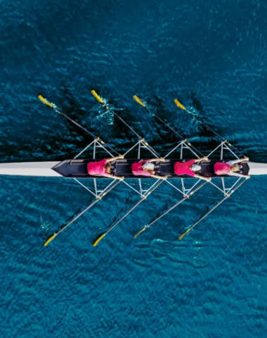 Women’s rowing team on blue water