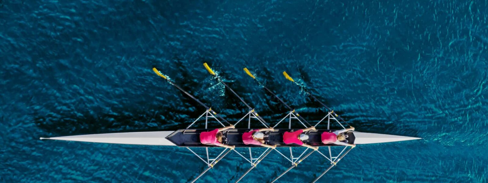 Women’s rowing team on blue water