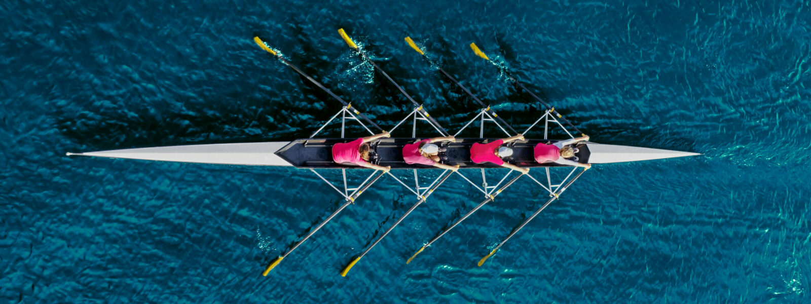 Women’s rowing team on blue water