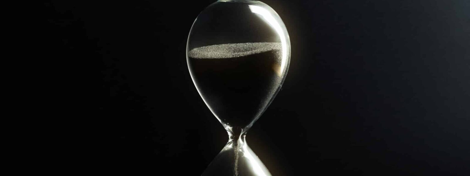 Hourglass on dark background