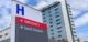 direction sign with capital letter H for hospital