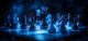 dark psychology power control concept. A mystical chess scene illuminated by blue light, featuring various pieces arranged on a dark board.