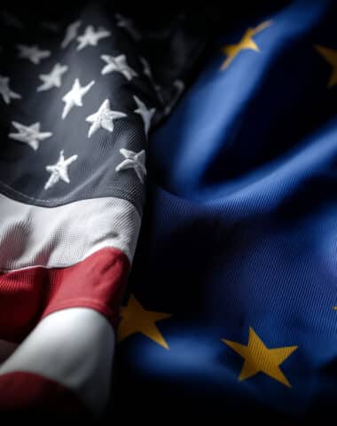 Flags of USA and EU are signifying international relations, cooperation or conflict between countries