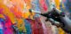 robotic hand of artificial intelligence, generating an abstract oil painting with a brush and oil paint. creativity and sensitivity with ai, and plagiarism or copyright issues