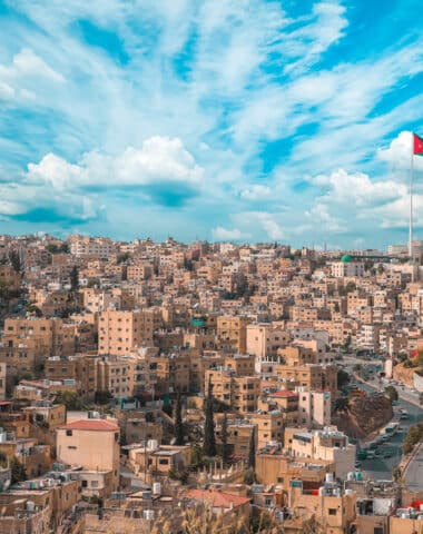 Scenic shot of the city of Amman with the Jordan flag in Jordan