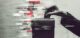 A hand holding a&nbsp;ballot box merged with fake news and manipulated algorithms, highlighting election interference