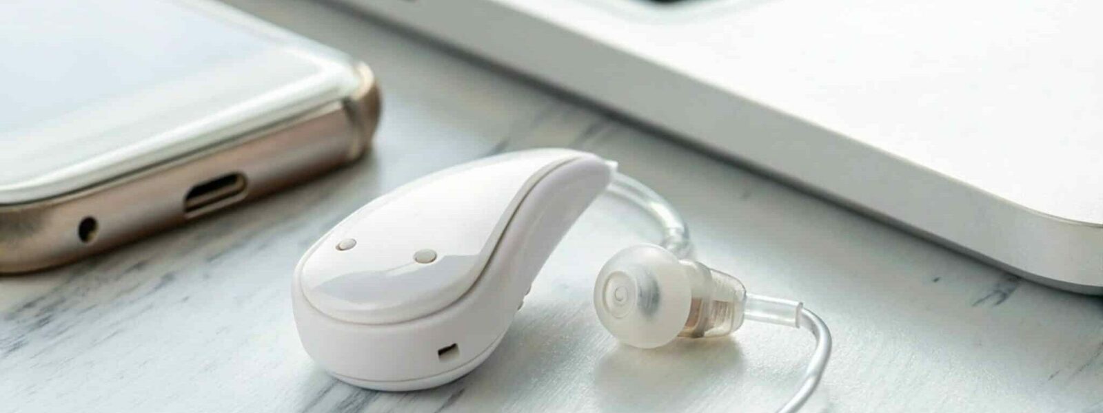 Close Up of White Hearing Aid Device on Clean Background Representing Assistive Technology