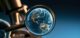 Detailed view of the planet earth seen through a&nbsp;magnifying glass focusing on continents and ocean highlighting geography and environment in scientific study